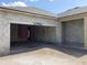 Spacious two car garage under construction with concrete walls and visible framing at 5722 Cattle Ranch Drive, St Cloud, FL 34771