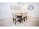 Inviting dining room with stylish table, chairs, decorative wall art, and light fixture at 10274 Julia Isles Ave, Oxford, FL 34484