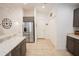Bright kitchen with stainless steel appliances, granite countertops and tile flooring at 10274 Julia Isles Ave, Oxford, FL 34484