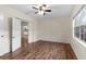 Bright, open bedroom with luxury vinyl plank flooring, neutral paint and a large window at 107 Alachua Dr, Winter Haven, FL 33884