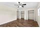 Bedroom with stylish floors, ceiling fan and closet storage at 107 Alachua Dr, Winter Haven, FL 33884