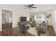 Open concept living room with luxury vinyl plank flooring, modern furnishings and lots of natural light at 107 Alachua Dr, Winter Haven, FL 33884