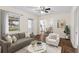 Inviting living room featuring an open floor plan, neutral tones, wood-look floors, and lots of natural light at 107 Alachua Dr, Winter Haven, FL 33884