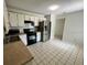 Eat-in kitchen featuring stainless steel appliances, white cabinets, and tile flooring at 299 Cobalt Dr, Kissimmee, FL 34758