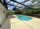 Refreshing pool and covered patio area, perfect for relaxing and entertaining guests at 299 Cobalt Dr, Kissimmee, FL 34758