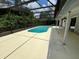 Inviting screened-in pool area surrounded by a spacious deck for entertaining at 299 Cobalt Dr, Kissimmee, FL 34758