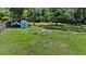 Spacious yard with a cozy fire pit and colorful chairs for outdoor enjoyment at 4621 Musket Dr, Lakeland, FL 33810