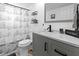 Stylishly updated bathroom with modern vanity, ship-themed shower curtain, and neutral decor at 4621 Musket Dr, Lakeland, FL 33810