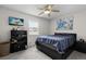 Comfortable bedroom with a ceiling fan, natural light, and simple, modern decor at 4621 Musket Dr, Lakeland, FL 33810