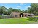 Inviting single-story home with a well-maintained lawn and mature trees at 4621 Musket Dr, Lakeland, FL 33810
