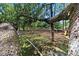 Unique, tree-suspended hammock feature, offering a relaxing outdoor space amid lush greenery at 4621 Musket Dr, Lakeland, FL 33810