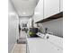 Laundry room with updated appliances, ample storage, and neutral paint at 4621 Musket Dr, Lakeland, FL 33810