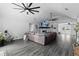 Spacious living room boasting high ceilings, fireplace, ceiling fan, and modern flooring at 4621 Musket Dr, Lakeland, FL 33810