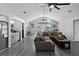 Bright living room featuring vaulted ceilings, modern floors, and a cozy seating area at 4621 Musket Dr, Lakeland, FL 33810
