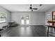 Bright living room featuring large windows and sliding glass doors for plenty of natural light at 4621 Musket Dr, Lakeland, FL 33810