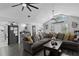 Open-concept living room featuring large windows, ceiling fans, and modern flooring at 4621 Musket Dr, Lakeland, FL 33810