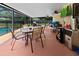 Inviting screened patio with a dining set, perfect for outdoor relaxation and entertainment by the pool at 4621 Musket Dr, Lakeland, FL 33810