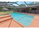 This sparkling swimming pool is enclosed with a screened-in patio, plus it includes a spa at 4621 Musket Dr, Lakeland, FL 33810