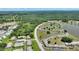 Aerial shot of the condo community, surrounded by lush foliage, and a serene lake at 523 Club Cir, Lakeshore, FL 33854