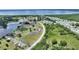 Community aerial featuring lush landscaping, mature trees, and manicured lawns, close to a lake at 523 Club Cir, Lakeshore, FL 33854
