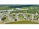 Scenic aerial shot of a community near a lake, featuring well-maintained lawns and inviting landscaping at 523 Club Cir, Lakeshore, FL 33854