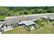 Birds-eye-view showcasing the property, featuring a screened-in patio and landscaped yard at 523 Club Cir, Lakeshore, FL 33854