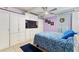 Spacious bedroom features ample storage, a comfortable bed, and a built-in television at 523 Club Cir, Lakeshore, FL 33854
