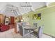 Bright dining room with chandelier lighting and vaulted ceilings at 523 Club Cir, Lakeshore, FL 33854
