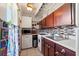 This cozy kitchen features stainless steel appliances, white cabinets and modern backsplash at 523 Club Cir, Lakeshore, FL 33854