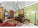Spacious living room with a cozy leather sofa and colorful rug at 523 Club Cir, Lakeshore, FL 33854