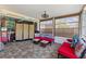 Enclosed patio with plenty of seating, fans, and lots of space for relaxing and entertaining at 523 Club Cir, Lakeshore, FL 33854