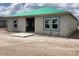New construction home exterior shows block construction with a green roof at 5724 Haystack Drive, St Cloud, FL 34771