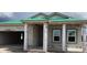 New construction home with concrete block walls and a green roof, showing the home being built at 5724 Haystack Drive, St Cloud, FL 34771