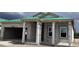 New construction home with concrete block walls and a green roof, showing the home being built at 5724 Haystack Drive, St Cloud, FL 34771
