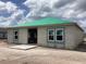 New construction home exterior shows block construction with a green roof at 5724 Haystack Drive, St Cloud, FL 34771