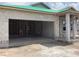 New construction home with concrete block walls and a garage showing the home being built at 5724 Haystack Drive, St Cloud, FL 34771