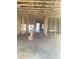 Unfinished interior showcasing bare framing, a concrete floor, and an open ceiling at 5724 Haystack Drive, St Cloud, FL 34771