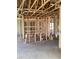 Unfinished interior showcasing bare framing and concrete floor at 5724 Haystack Drive, St Cloud, FL 34771
