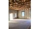 Unfinished living room featuring a concrete floor, bare walls, open ceiling, and one window at 5724 Haystack Drive, St Cloud, FL 34771