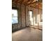New construction room with concrete walls, wood trim and newly installed windows allowing for plenty of sunlight at 5724 Haystack Drive, St Cloud, FL 34771