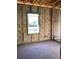 New construction room with concrete walls, wood trim and a newly installed window allowing for plenty of sunlight at 5724 Haystack Drive, St Cloud, FL 34771