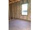 New construction room with concrete walls, wood trim and a newly installed window allowing for plenty of sunlight at 5724 Haystack Drive, St Cloud, FL 34771
