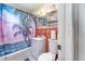 Cozy bathroom featuring a tub with palm tree shower curtain at 811 Casselberry Dr, Lake Wales, FL 33853
