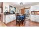 Dining area combined with kitchen, showcasing white cabinetry and functional design at 811 Casselberry Dr, Lake Wales, FL 33853