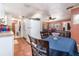 Open dining area with tile floors, seamlessly connected to a bright and airy kitchen at 811 Casselberry Dr, Lake Wales, FL 33853