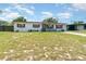 Pleasant home with a tidy lawn, charming porch, and a serene neighborhood ambiance at 811 Casselberry Dr, Lake Wales, FL 33853