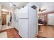 View of kitchen with tile flooring, white appliances, and ample cabinet storage space at 811 Casselberry Dr, Lake Wales, FL 33853