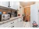 Kitchen with ample cabinet space and modern appliances, complemented by wood flooring at 811 Casselberry Dr, Lake Wales, FL 33853