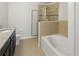 Bathroom featuring granite countertops, a soaking tub and a glass enclosed shower at 1183 Honey Blossom Dr, Orlando, FL 32824