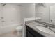 Bathroom featuring a shower-tub combo, granite vanity and tile floors at 1183 Honey Blossom Dr, Orlando, FL 32824